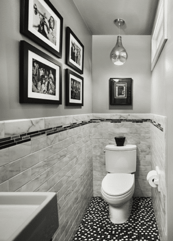 Custom powder room with toilet and wall art