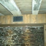 Antique-style diffuser register complements the historic design of the building