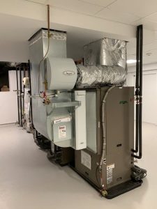 Picture of geothermal heating system sitting in home’s basement