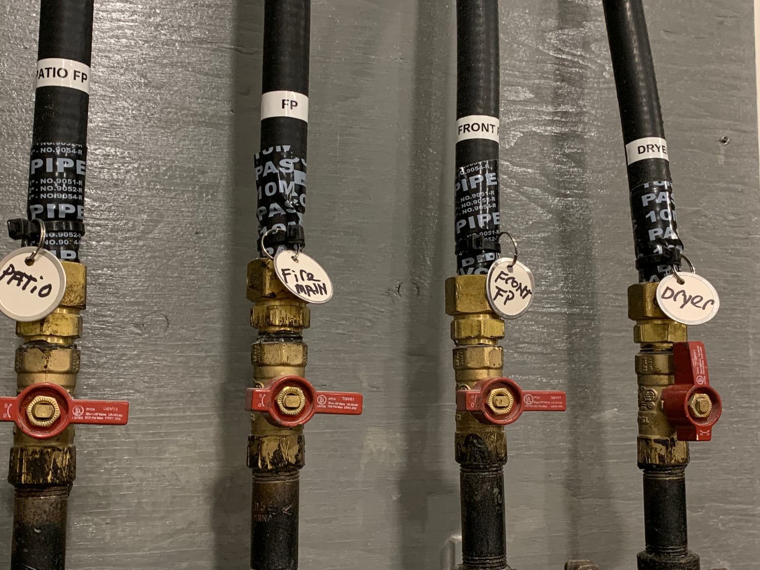 Close up of gas piping with room labels